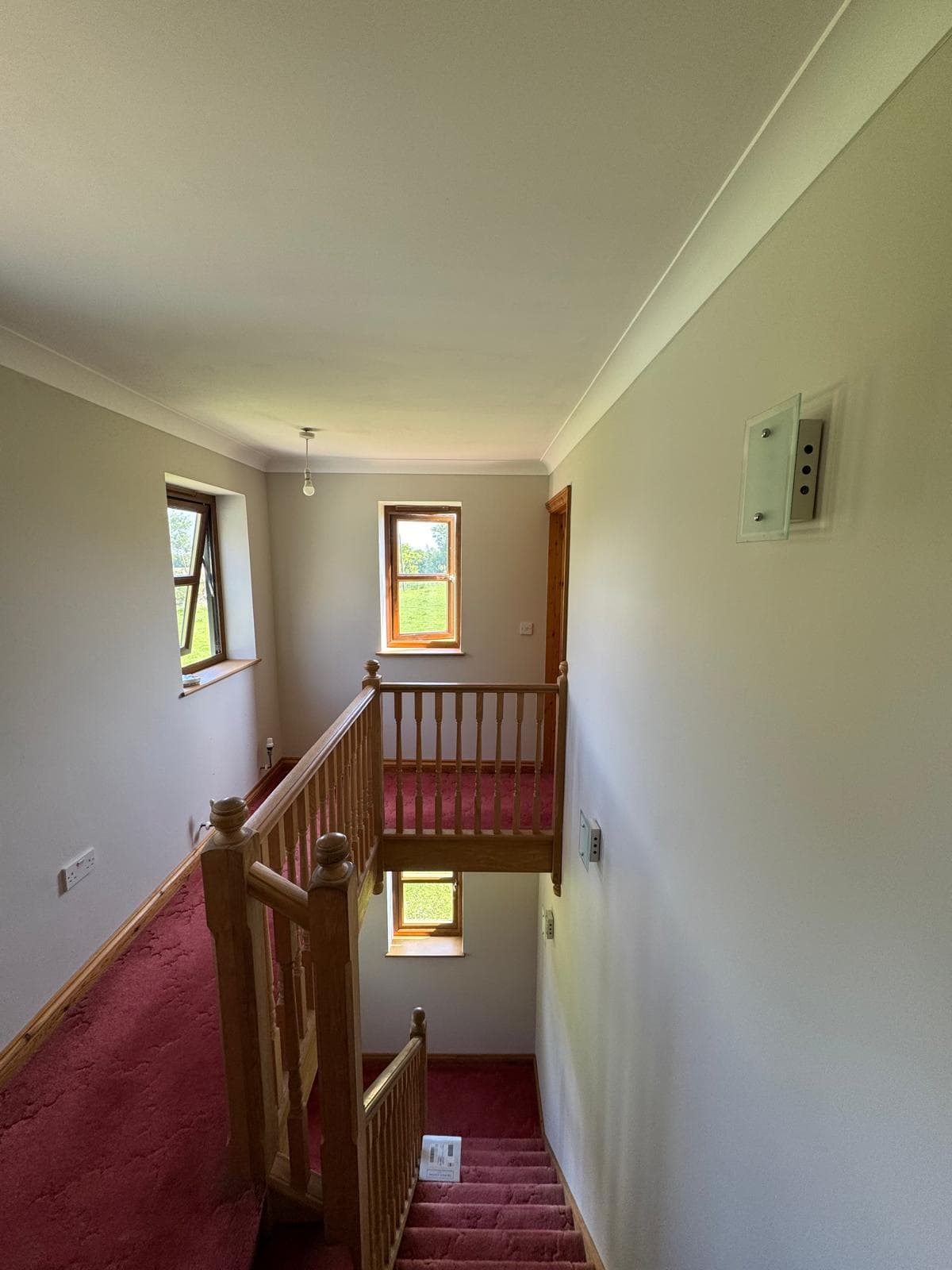 Lovely Farmhouse - Upper stairway landing with white walls
